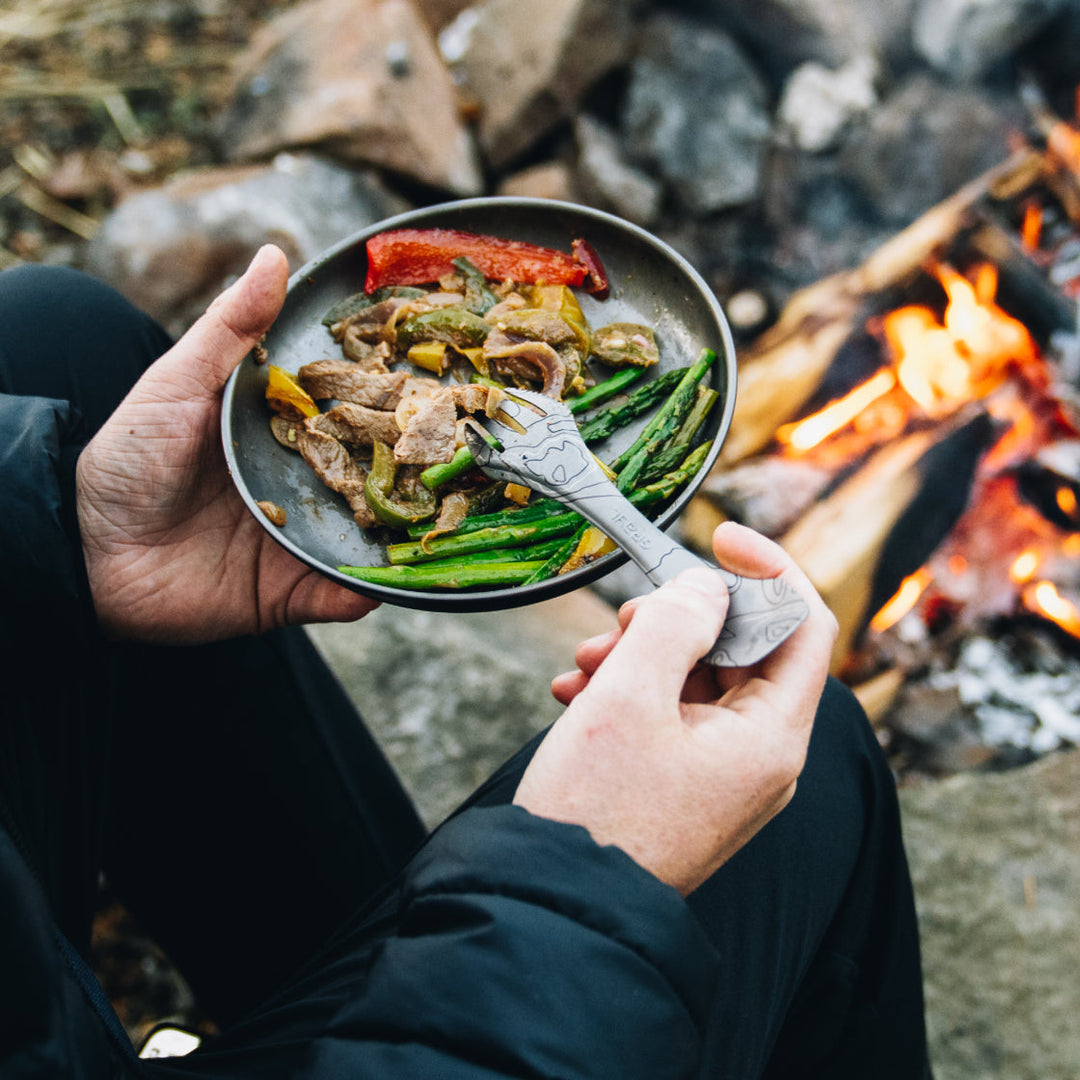 The Grayl Ti Plate keeps food on the dish and out of your lap. High wall / deep dish design.